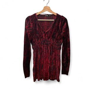 Burgundy velvet long-sleeve top with a V-neckline and ruched detailing. Soft, dr